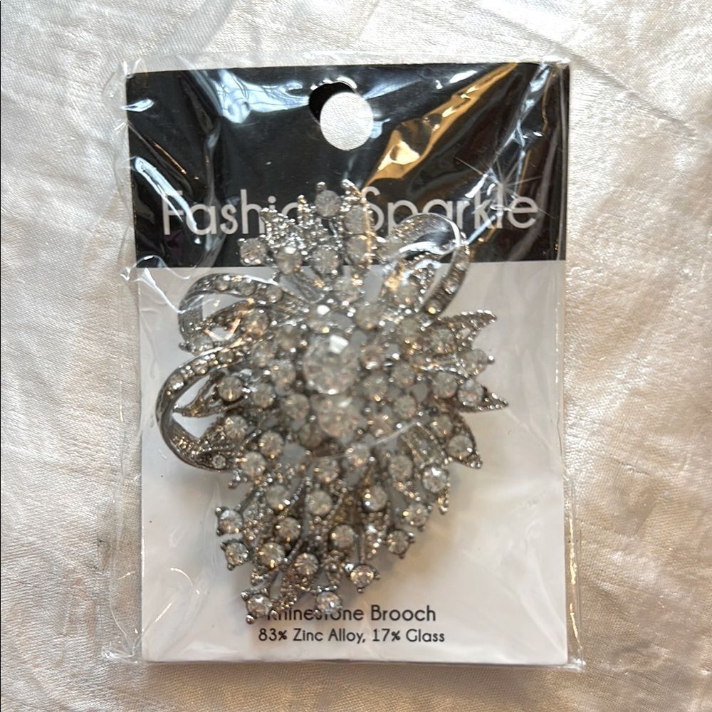 New in packaging large Silver Rhinestone Brooch‎